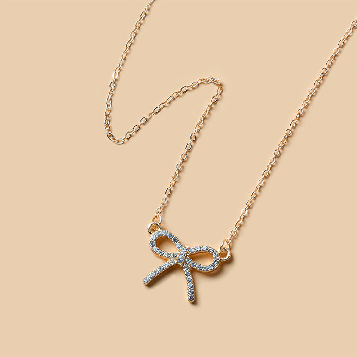 Aurora goudkleurige ketting met strik